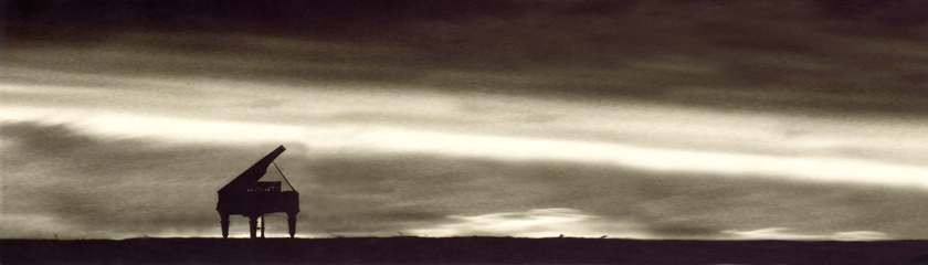 Grand piano silhouette against a dramatic sky